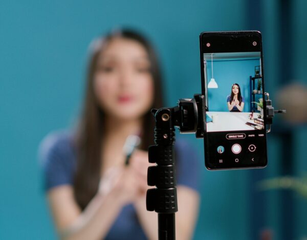 content-creator-recording-lifestyle-vlog-filming-camera-doing-makeup-tutorial-channel-website-female-influencer-broadcasting-live-video-with-beauty-cosmetics-products-close-up